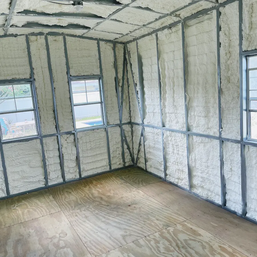 Closed-cell spray foam insulation applied to wall cavities in a residential project in Corsicana